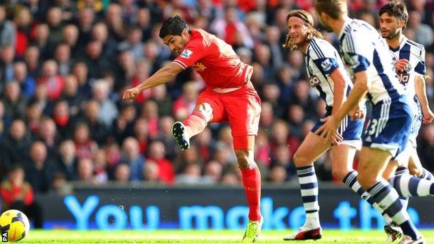 Luis Suarez scores the opening goal against West Brom