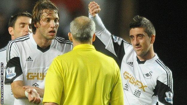 Michu and Neil Taylor make their point at the end of the game