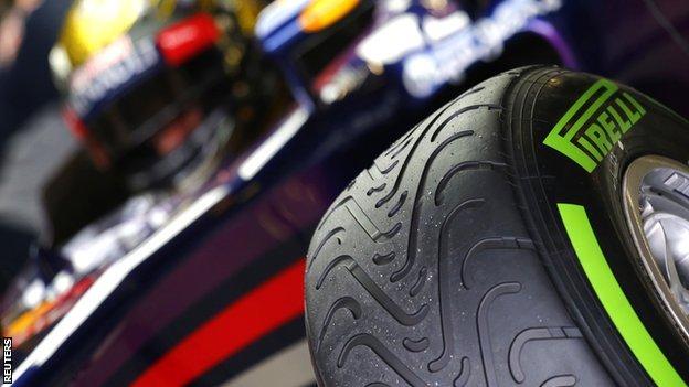 Sebastian Vettel with tyre in foreground