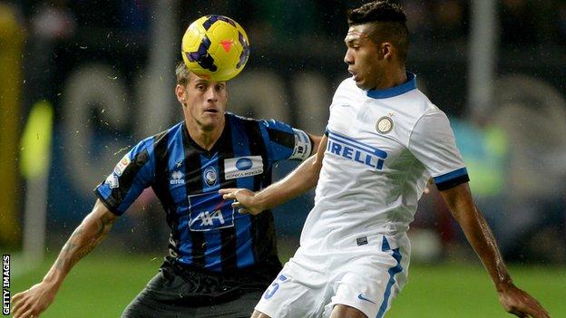 Atalanta's German Denis, left, challenges Juan Jesus of Inter Milan.