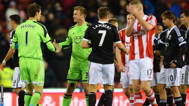 Asmir Begovic shakes hands with Artur Boruc at the end of Stoke's draw with Southampton