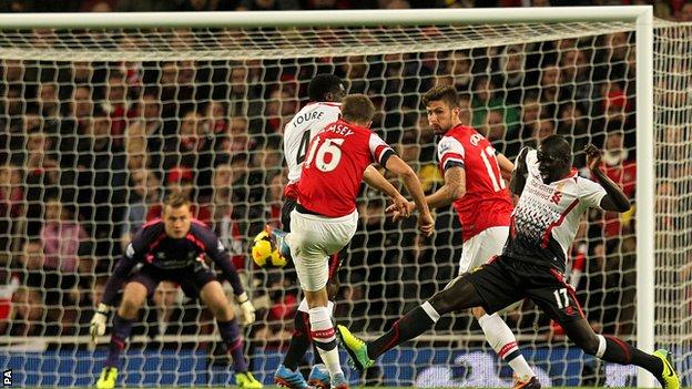 Arsenal midfielder Aaron Ramsey scores against Liverpool