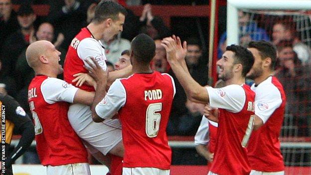 Steve Schumacher celebrates with his team-mates