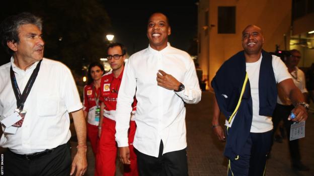 Musician Jay-Z arrives in the F1 paddock following practice for the Abu Dhabi Grand Prix
