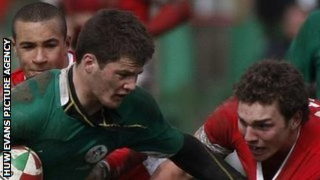 Ireland's Sam Coghlan-Murray tries to fend off Wales' George North as Eli Walker moves in during the 2010 Five Nations Under-18 festival