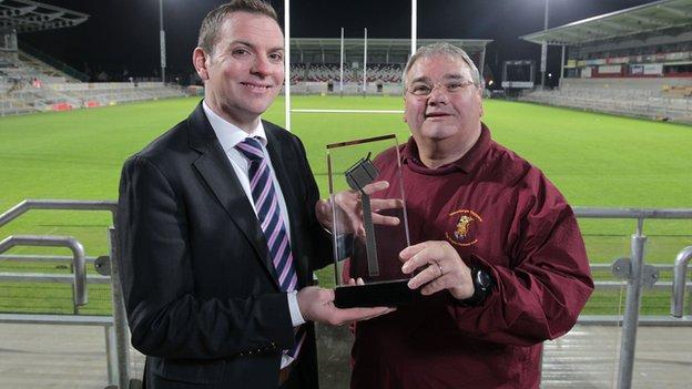 Sam McBurney receives his award from BBC Sport NI's Thomas Kane