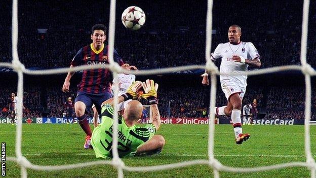 Barcelona's Argentine forward Lionel Messi (left) scores during the Champions League Barcelona v AC Milan