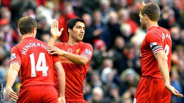 Jordan Henderson, Luis Suarez and Steven Gerrard of Liverpool