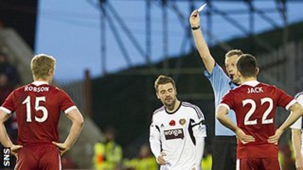 Aberdeen sub Barry Robson is shown a second yellow card, with a red to follow