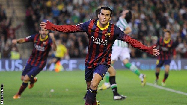 Pedro celebrates scoring for Barcelona against Real Betis