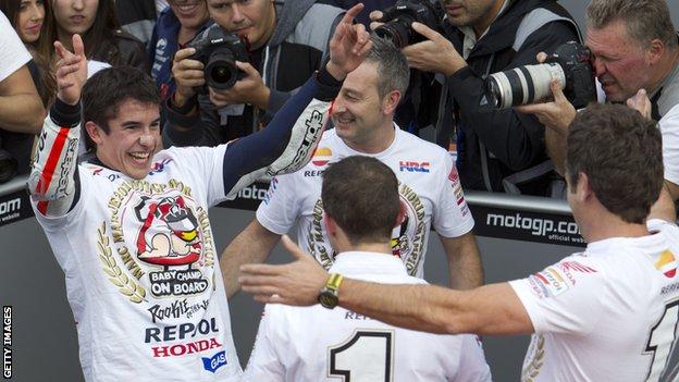 Marc Marquez celebrates winning MotoGP title