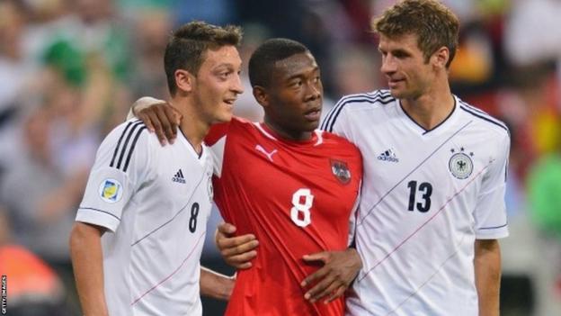David Alaba of Austria with Mesut Ozil and Thomas Muller during the World Cup qualifier between Germany and Austria