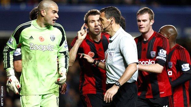 West Brom protest to referee Andre Marriner at Stamford Bridge
