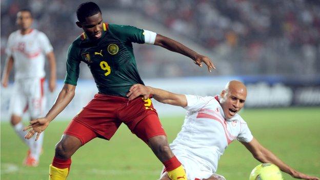 Samuel Eto'o (left) in action against Tunisia