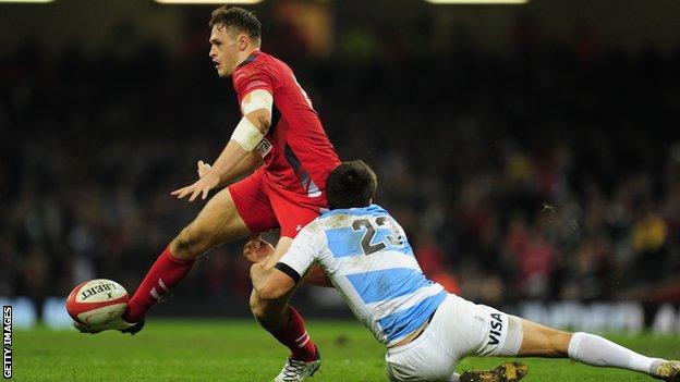 Wales centre Cory Allen rides a tackle against Argentina