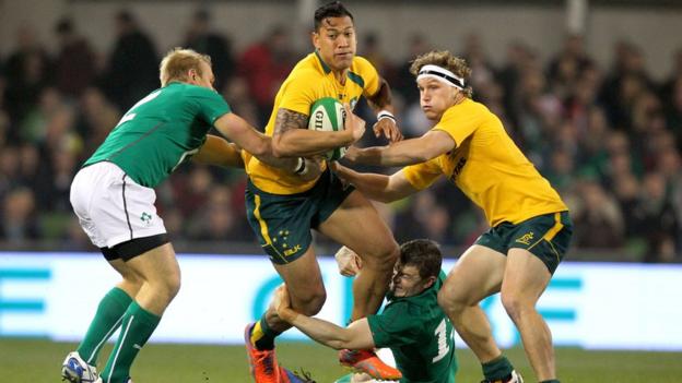 Australia full-back Israel Folau is tackled by Ireland's Luke Marshall and Brian O'Driscoll