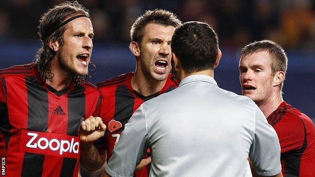 Angry Albion players Jonas Olsson, Gareth McAuley and Chris Brunt appeal to referee Andre Marriner over his decision to award Chelsea a penalty at Stamford Bridge