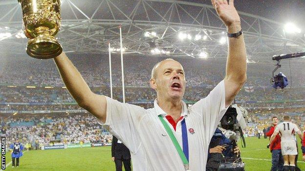 Sir Clive Woodward holds the World Cup aloft