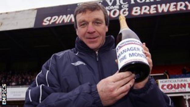 Graham Turner, in his days as Hereford United manager, holds aloft one of his many Manager of the Month awards