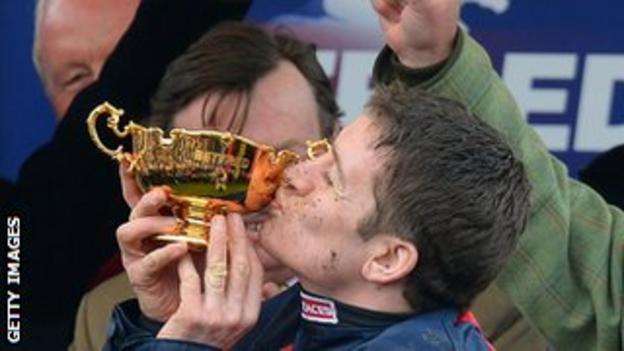 Barry Geraghty kisses the cup after winning the Betfred Cheltenham Gold Cup