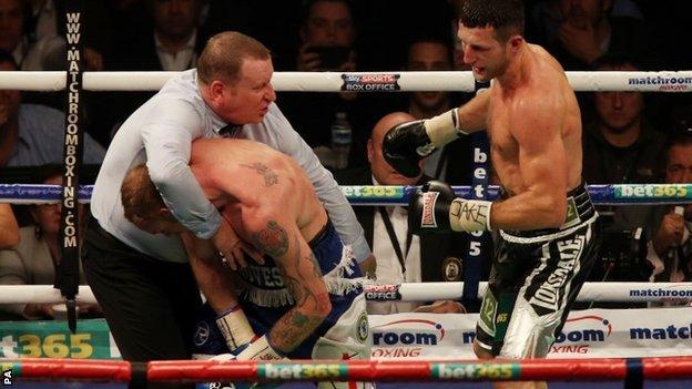 Referee Howard Foster stops Carl Froch (right) and George Groves in their WBA and IBF super- middleweight Title