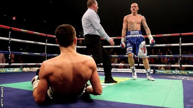 Carl Froch is knocked down to the canvas by George Groves