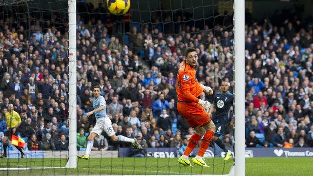 Jesus Navas (left) watches his chip beat Tottenham keeper Hugo Lloris which put Manchester City ahead after 14 seconds