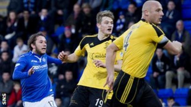 St Jonstone's Stevie May (left) watches his opening goal go in against Livingston