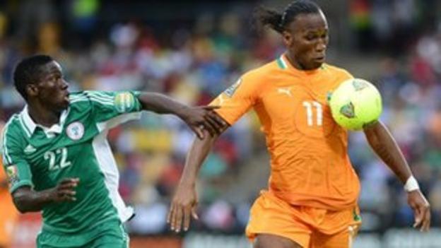 Nigeria's Kenneth Omeruo (left) tries to tackle Ivory Coast's Didier Drogba