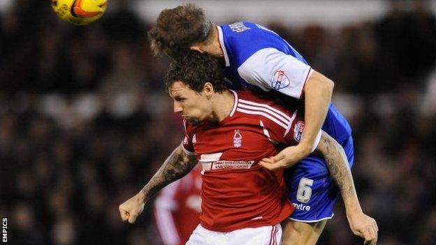 Ipswich Town's Christophe Berra wins the ball above Nottingham Forest's Darius Henderson