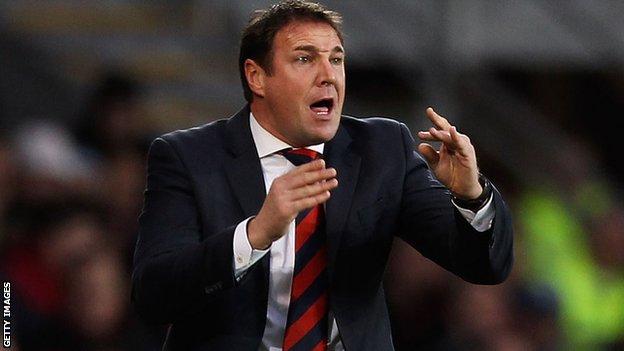 Cardiff City manager Malky Mackay gesticulates to his players from the touchline