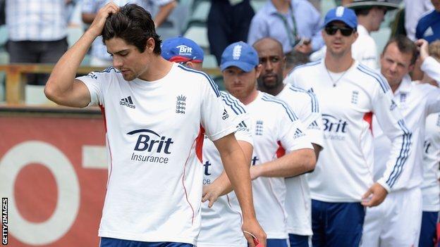 Alastair Cook leads the England players after their defeat in Perth