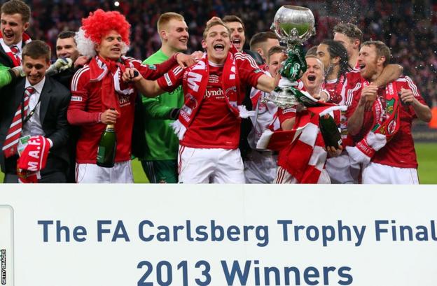 Wrexham's first Wembley appearance ended in triumph as they beat Grimsby Town on penalties to win the FA Trophy.
