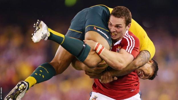 British and Irish Lions wing George North carries Australia wing Israel Folau during the second Test, a match which the tourists lost 16-15.