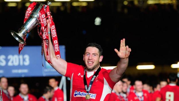 Alex Cuthbert celebrates winning the Six Nations after scoring two tries as Wales beat England