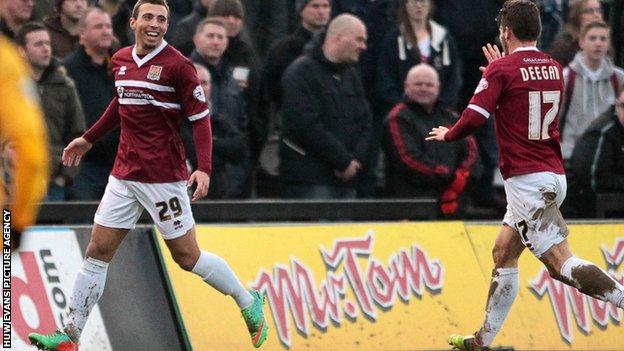 Northampton's Hallam Hope celebrates his side's opener at Newport County