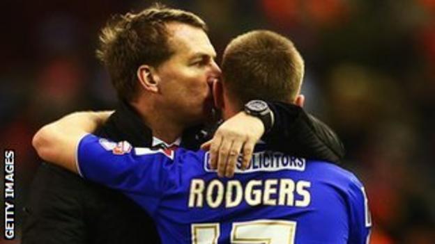 Liverpool manager Brendan Rodgers hugs his son Anton, who came on as a substitute for Oldham