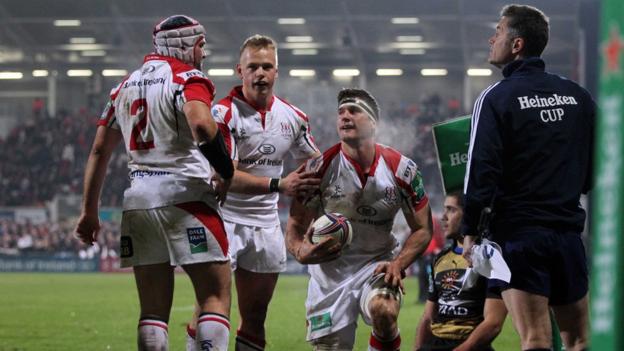 Rory Best and Luke Marshall congratulate Ulster try-scorer after he dives over in the corner for the opening try