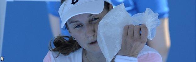 Ekaterina Makarova cools down with an ice pack