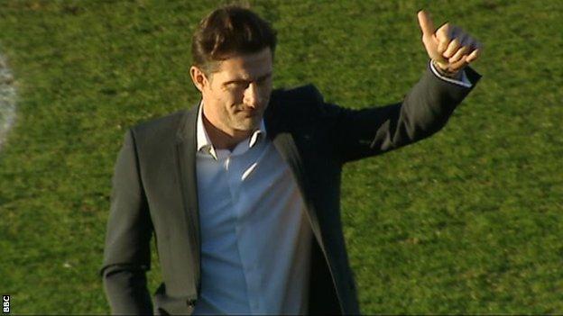 Chris Hargreaves gives the thumbs-up to the travelling Torquay fans before kick-off