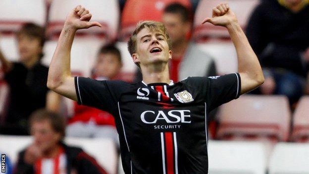 Patrick Bamford celebrates a goal while on loan with MK Dons