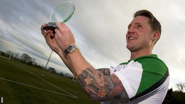 Kris Commons shows off his player of the month award