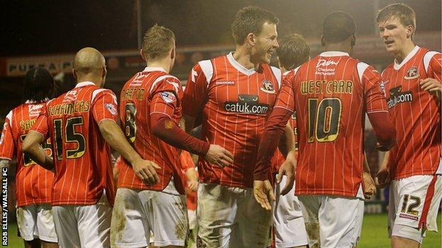 Walsall's player celebrate their midweek matchwinner against Oldham