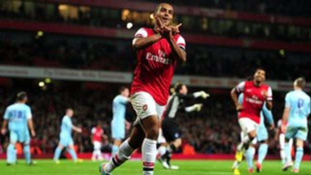Theo Walcott celebrates scoring Arsenal's final goal in the 6-1 League Cup win over Coventry City at the Emirates, September 2012