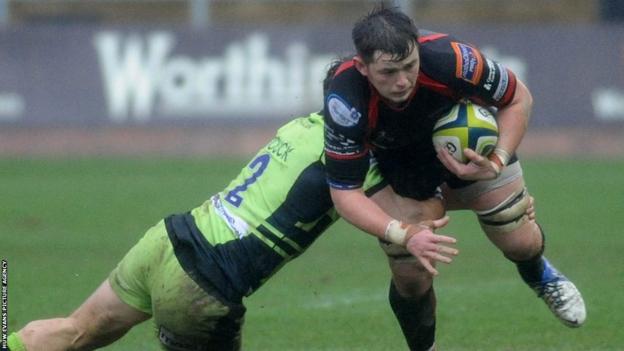 Northampton’s Mike Haywood tackles Newport Gwent Dragons back-row James Benjamin in the LV= Cup clash at Rodney Parade.