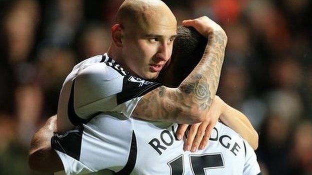Jonjo Shelvey (left) celebrates scoring Swansea's first goal against Fulham with team-mate Wayne Routledge