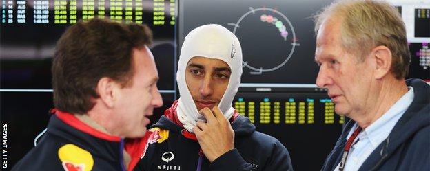 Red Bull team principal (left) talks with driver Daniel Ricciardo (centre) and motorsport consultant Dr Helmut Marko.