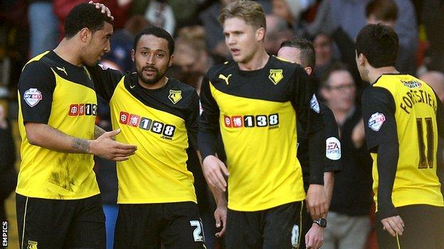Watford's Ikechi Anya (second left) celebrates with his team-mates after scoring against Brighton