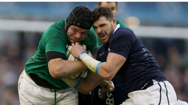 Prop Mike Ross comes up against Sean Lamont as Ireland emerge 22-point winners in their Six Nations opener