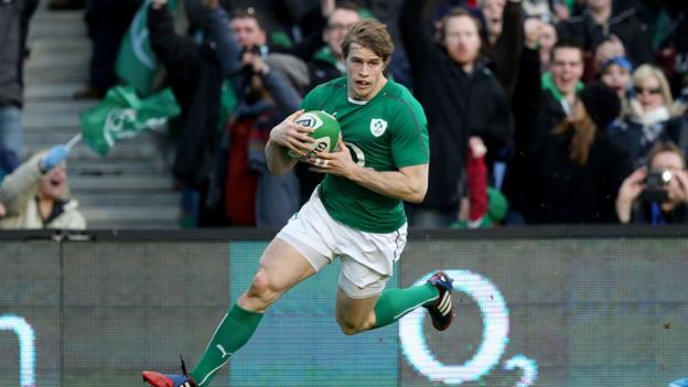 Winger Andrew Trimble prepares to touch down for the opening try of the game